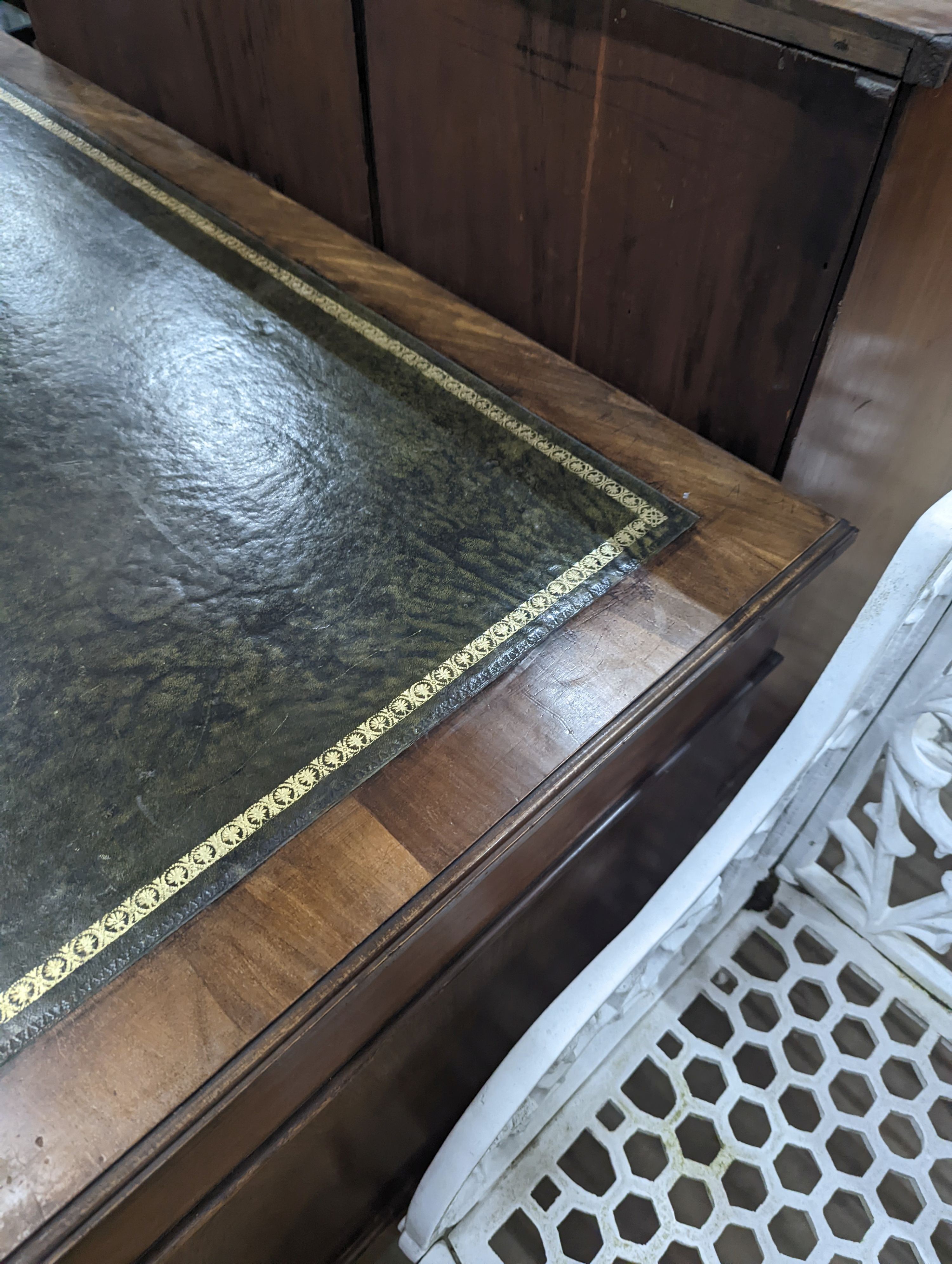 A late Victorian walnut pedestal desk, length 122cm, depth 68cm, height 76cm